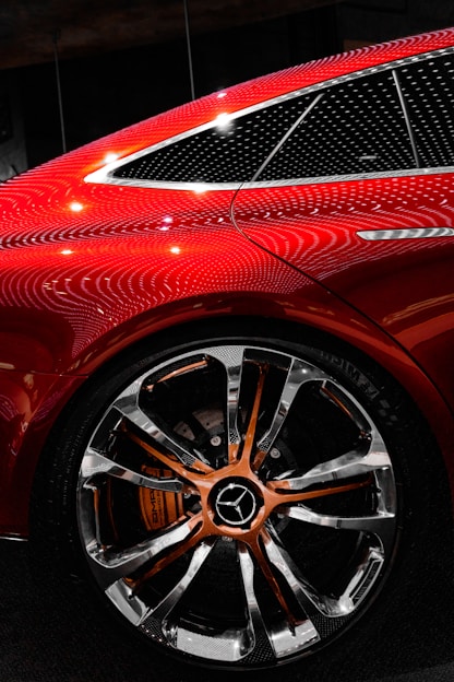 a close up of a red car on display