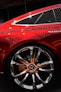 a close up of a red car on display