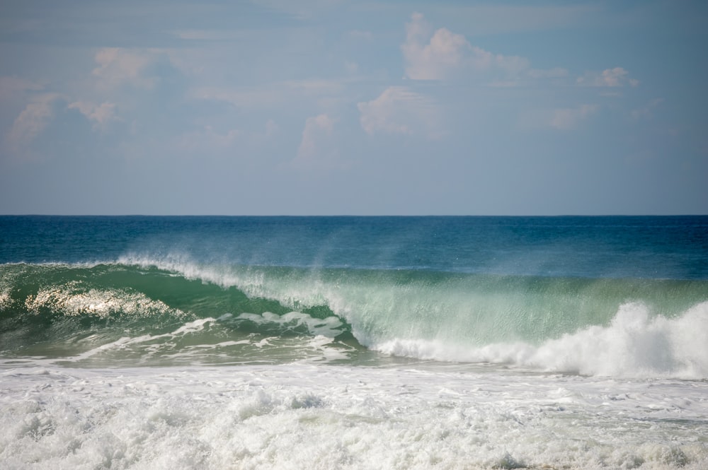 a large wave is coming in to shore