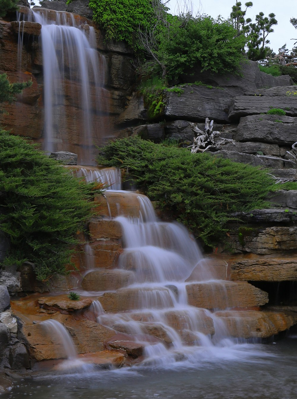 a large waterfall with lots of water coming out of it