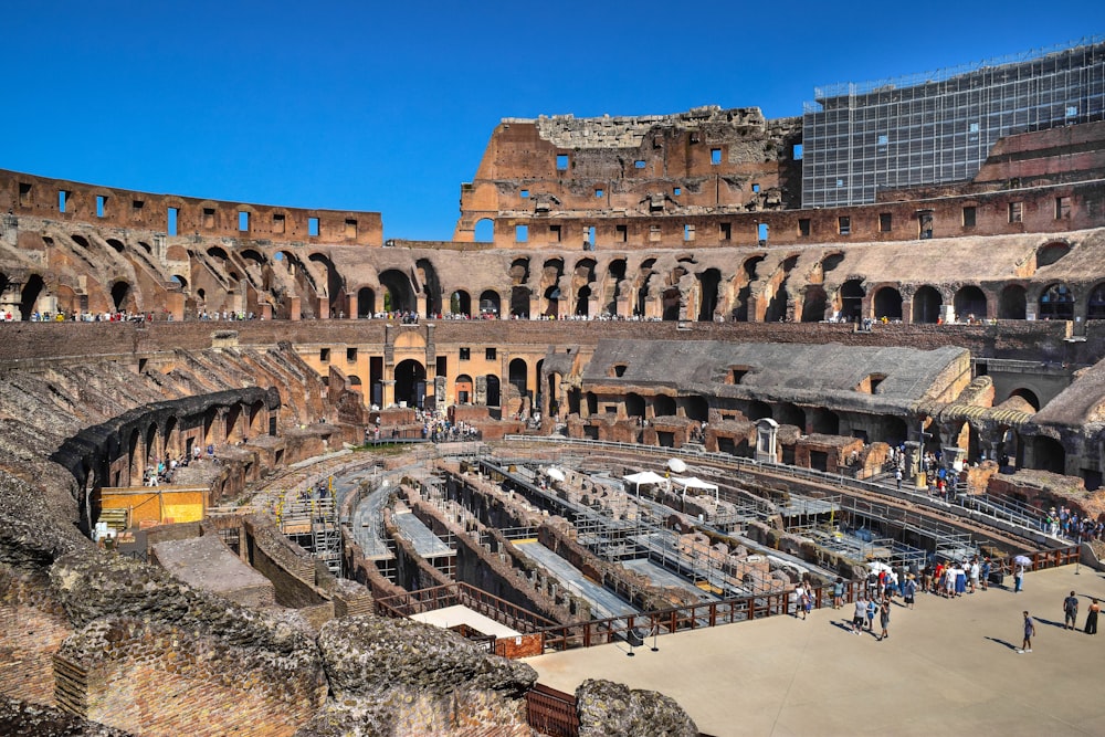 a group of people standing inside of an old building