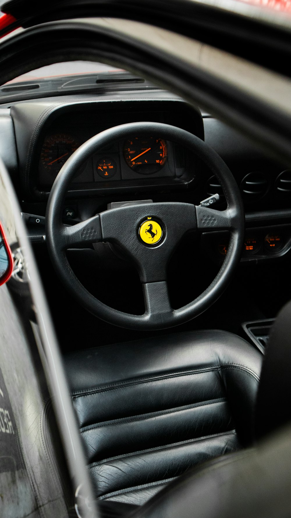 a close up of a steering wheel and dashboard of a car