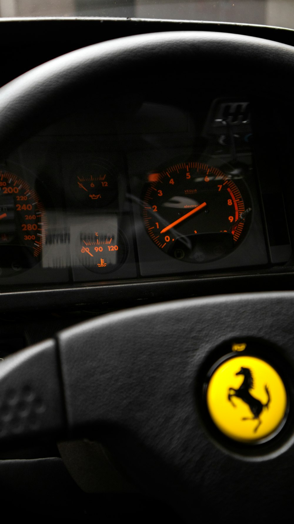 a close up of a dashboard with a speedometer