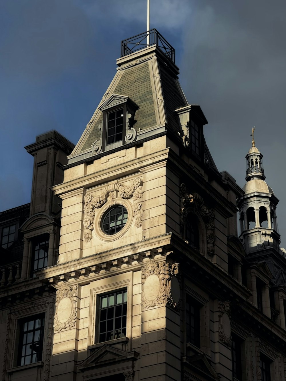 a tall building with a clock on the top of it