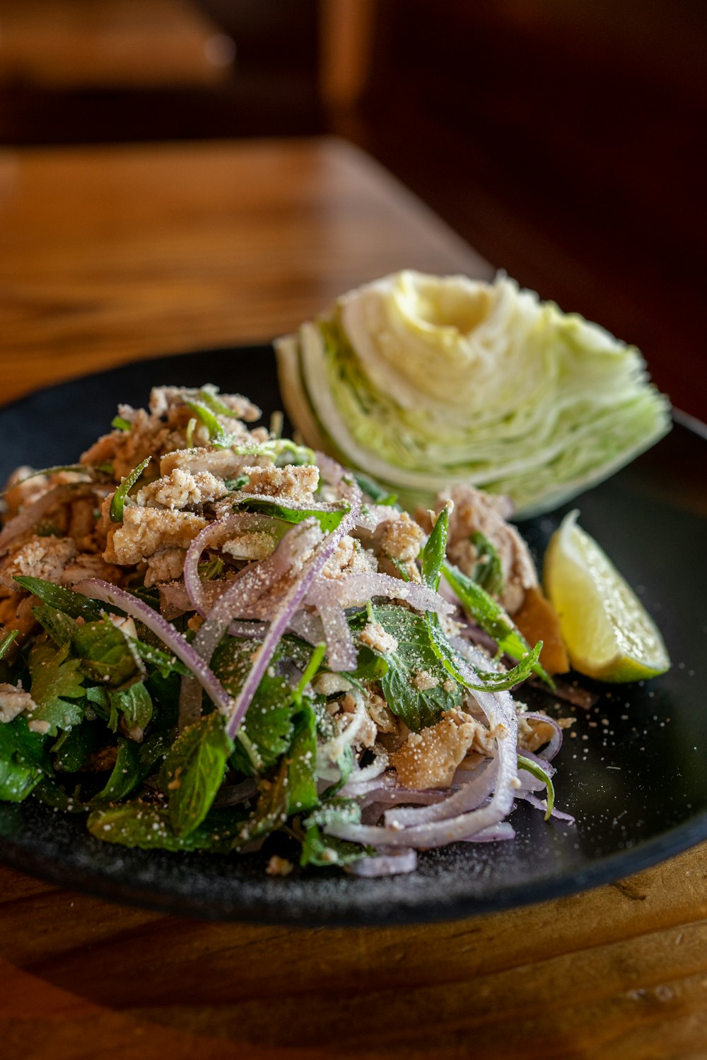 a plate of food on a wooden table