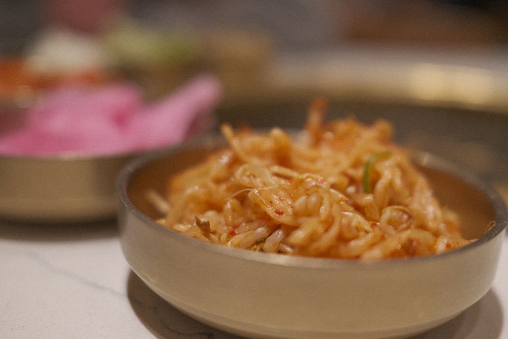 a close up of a bowl of food on a table