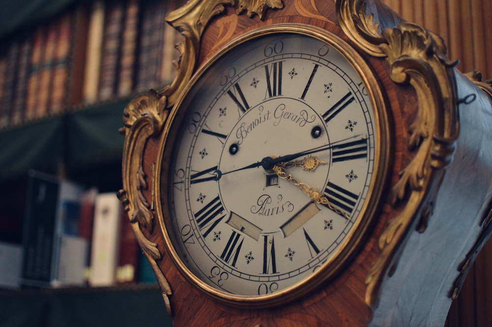 an old clock with roman numerals on it