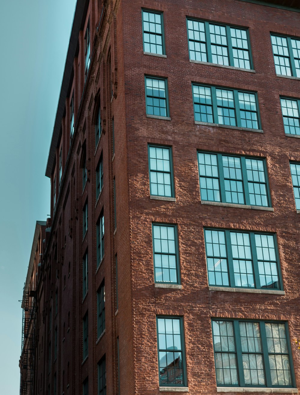 a tall brick building with lots of windows