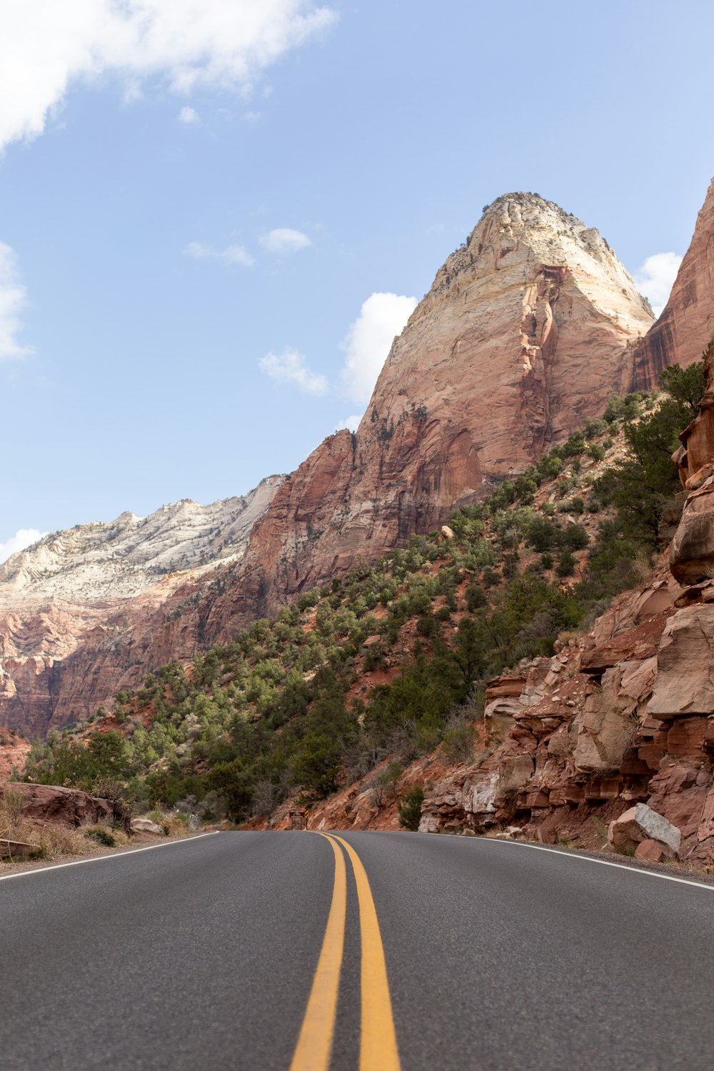 a road with a mountain in the background