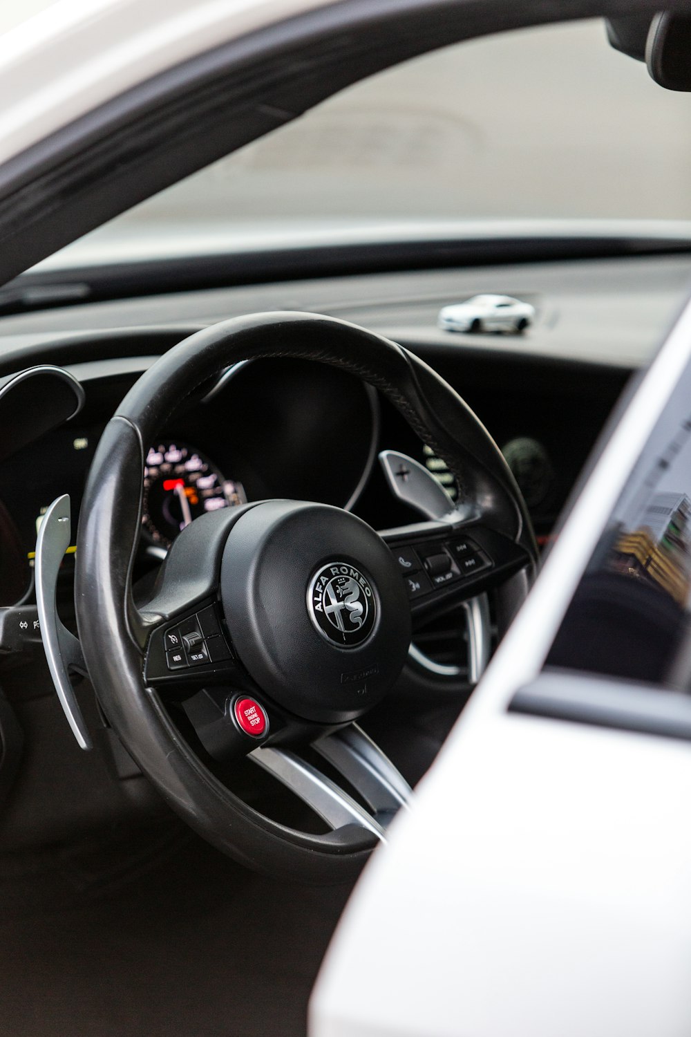 a steering wheel and dashboard of a car