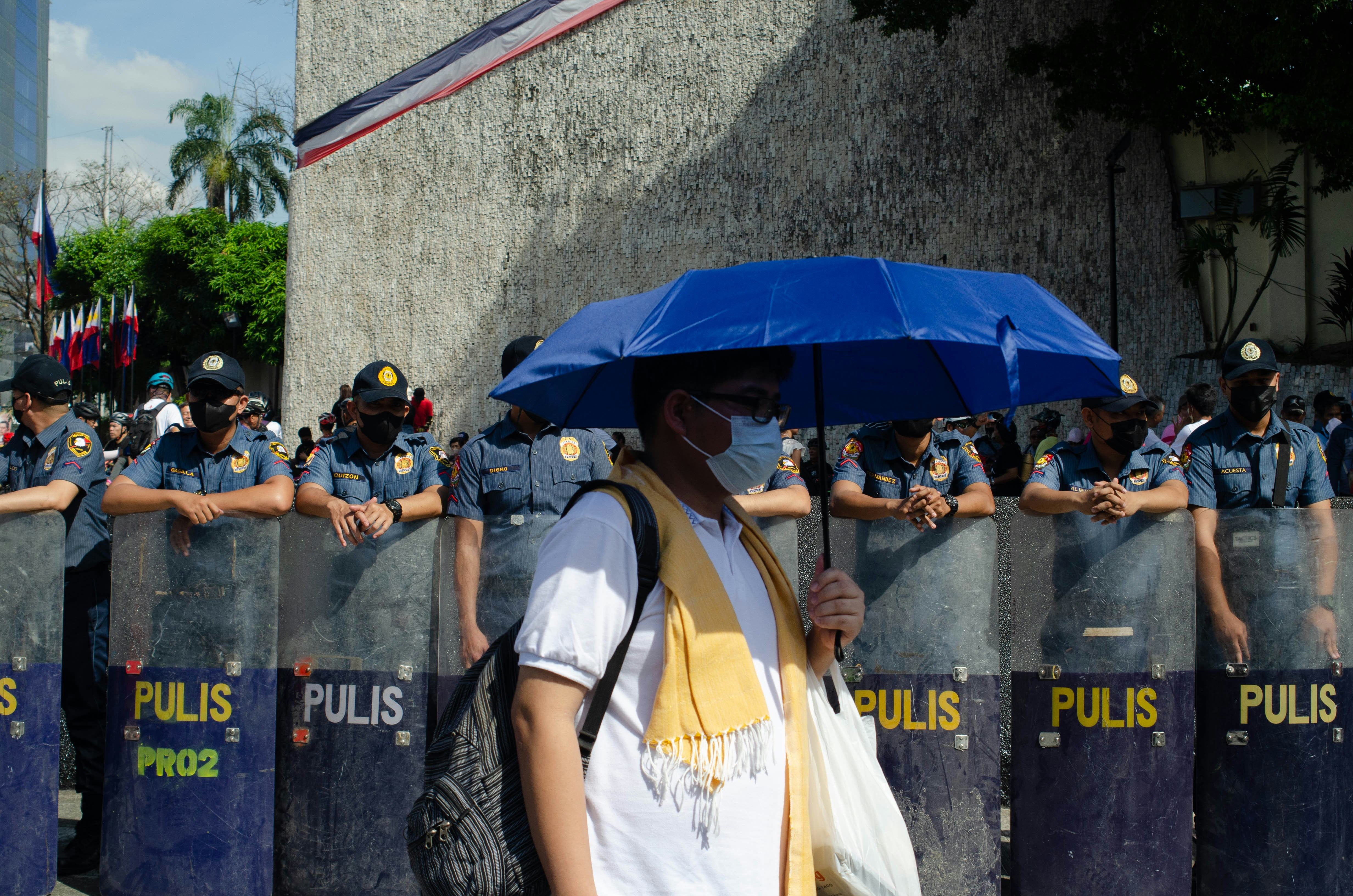a group of police officers standing in front of a wall