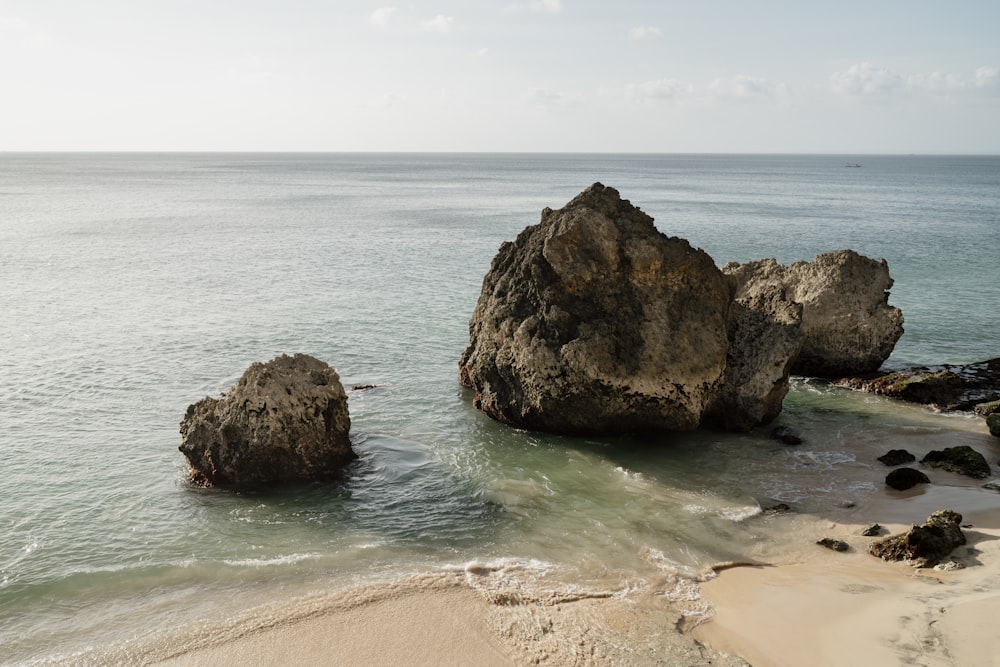 two large rocks sticking out of the ocean