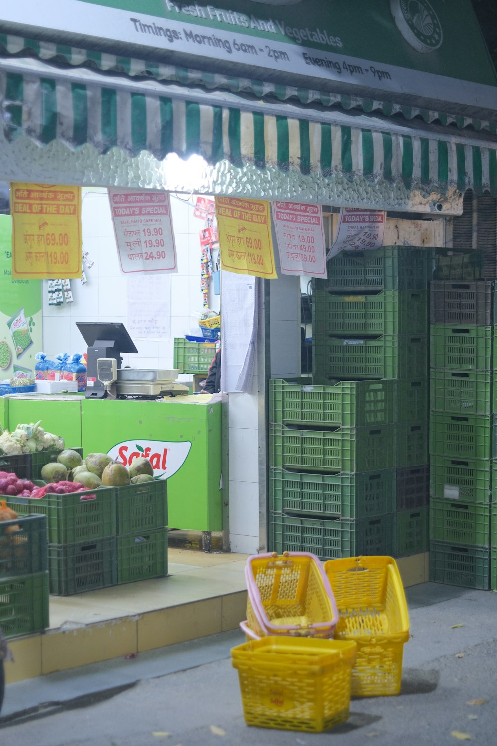 a store with crates of fruit and vegetables in front of it