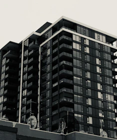 A modern residential condominium building with connected internet devices visible.