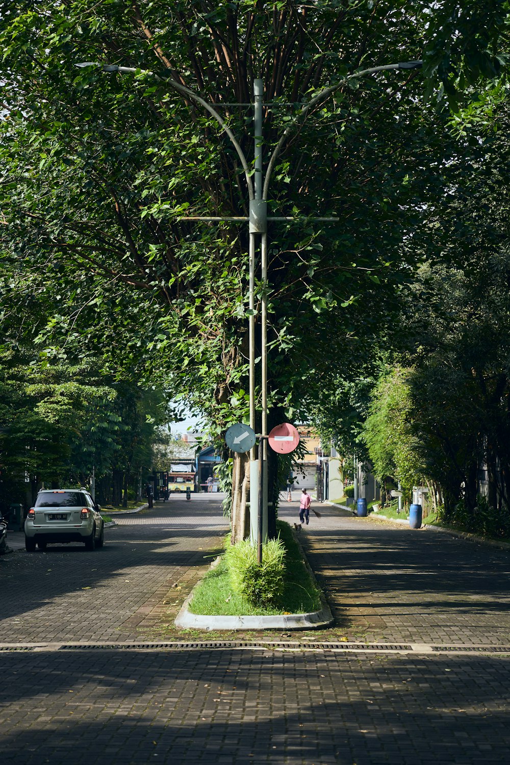 a street with cars parked on the side of the road