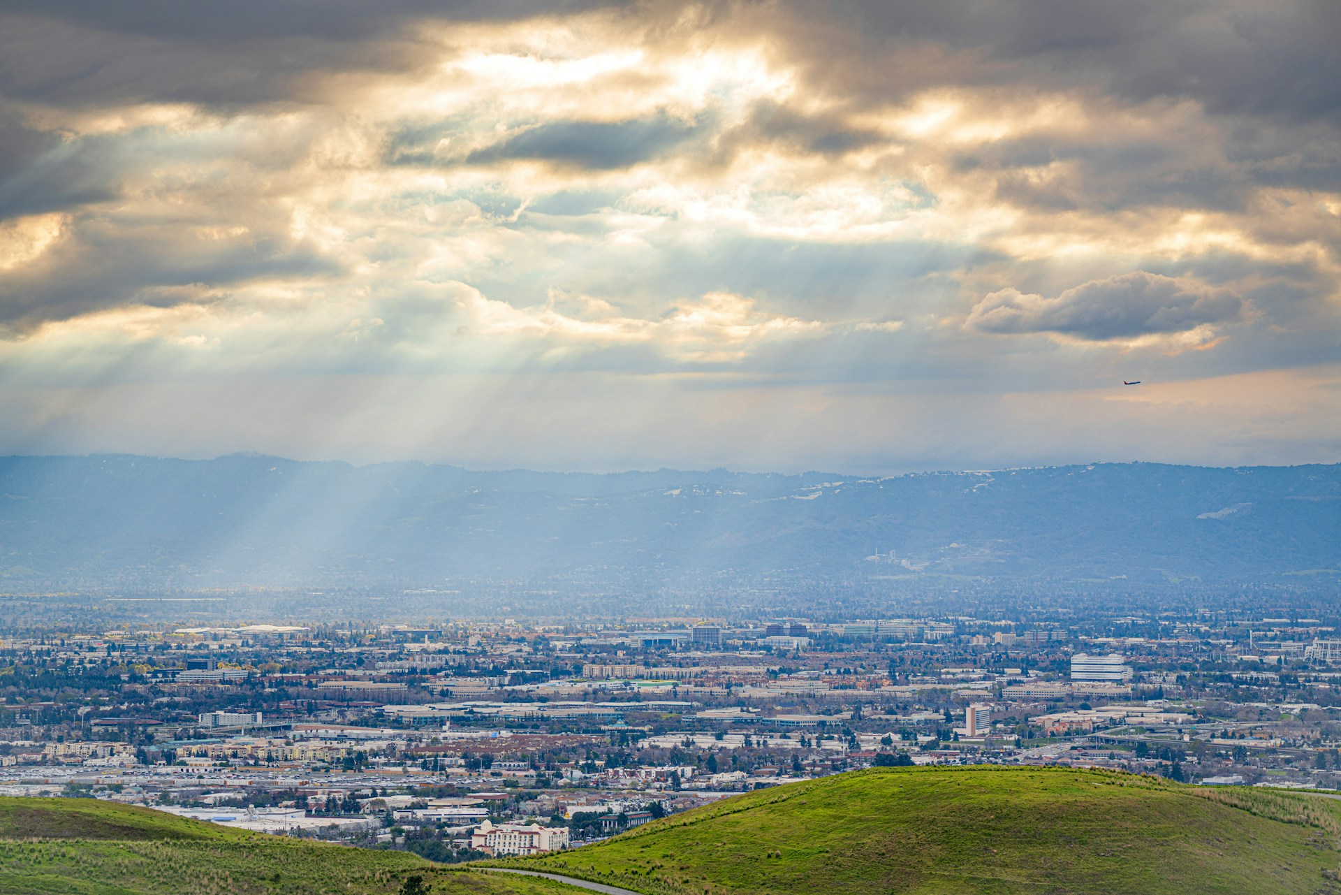 woman wearing yellow long-sleeved dress under white clouds and blue sky during daytime
