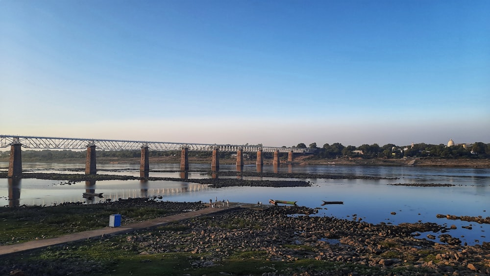 a bridge over a body of water with a sky background