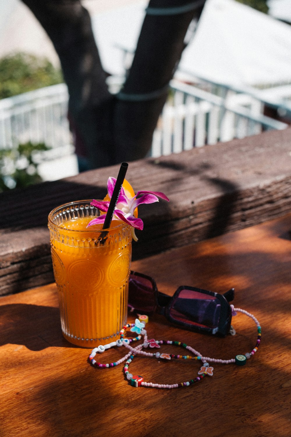 a drink sitting on top of a wooden table