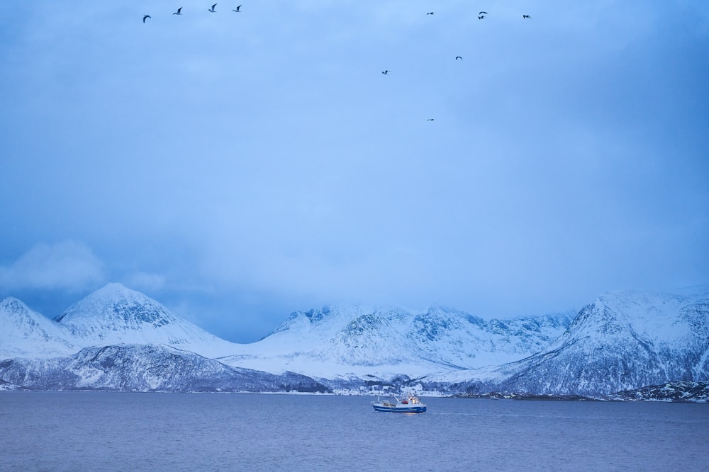 a boat floating on top of a large body of water