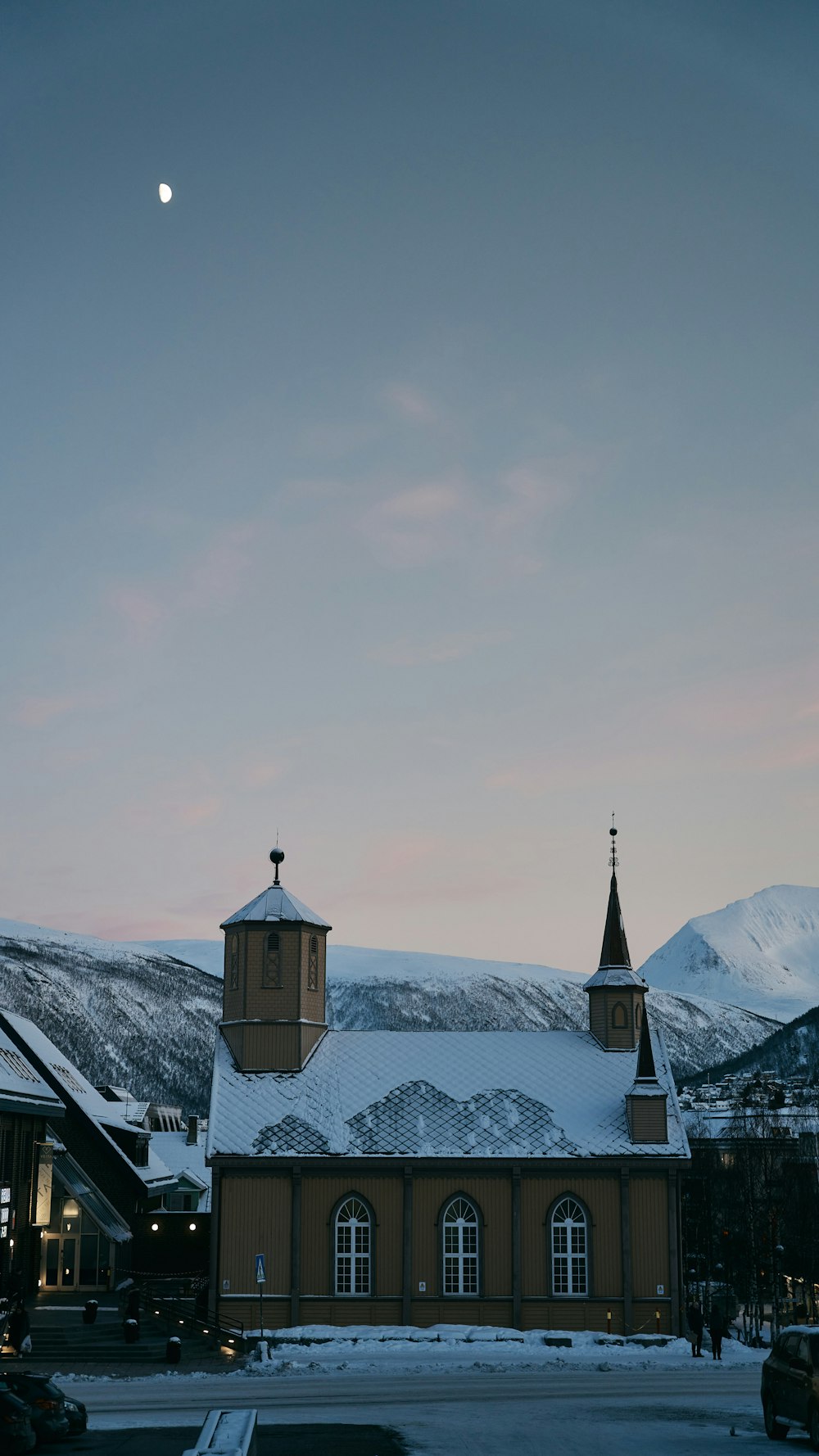 a church in the middle of a snowy landscape