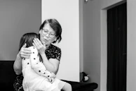 Illustrations from 'Super Grandma' showing a loving grandmother embracing her grandchild.