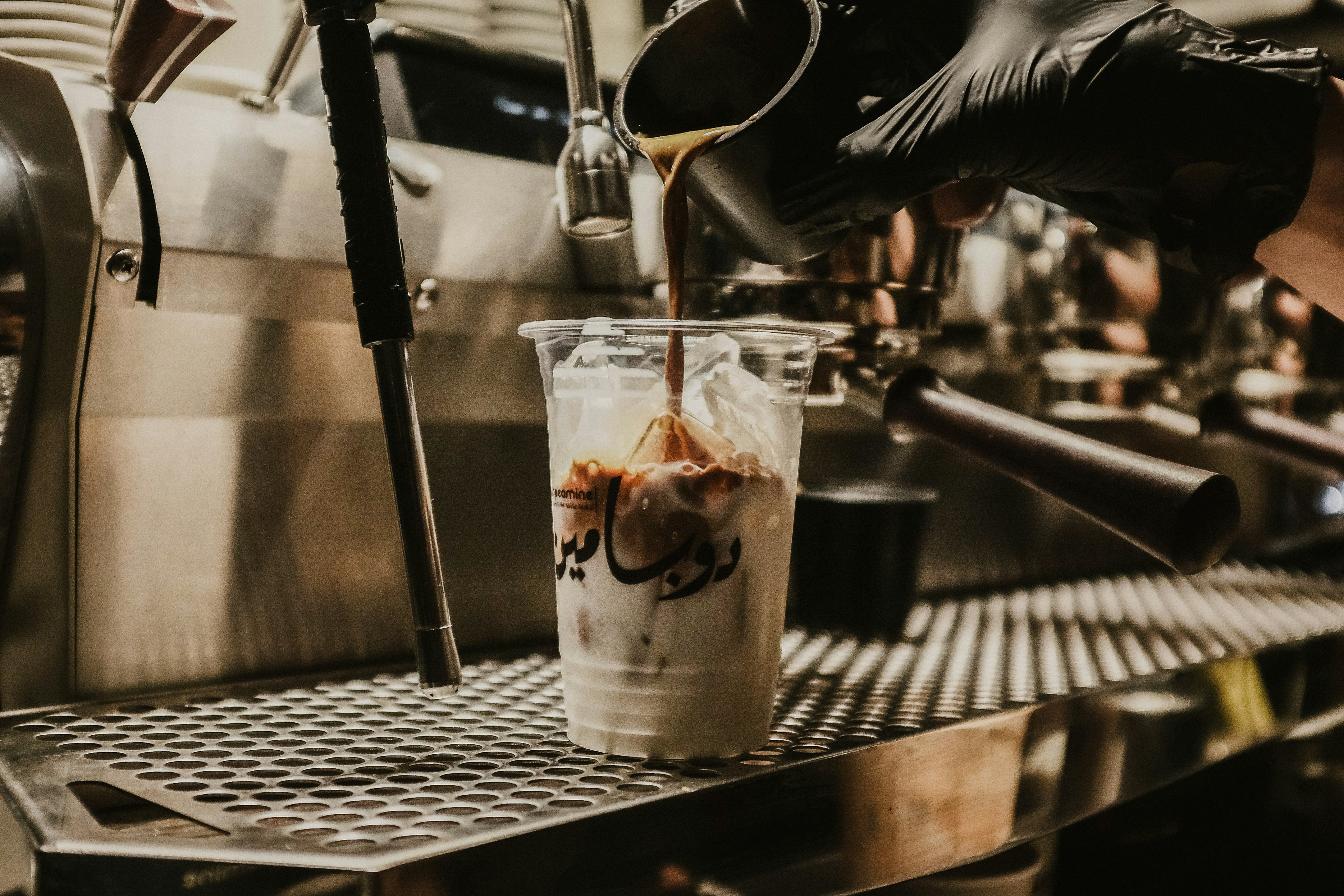 Coffee being poured into a glass