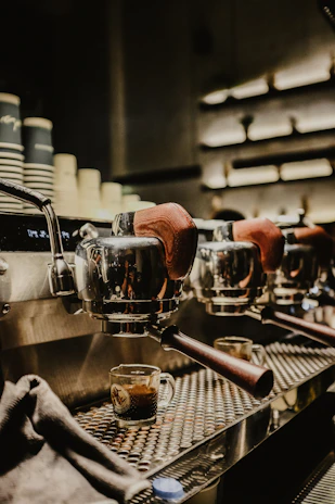 Rows of well-maintained coffee machines ready for delivery to local bars and restaurants.