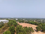 A scenic view of a team’s lodging nestled close to the sports venue under a clear sky.