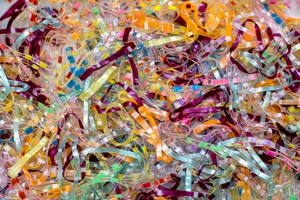 a pile of colorful streamers sitting on top of a table