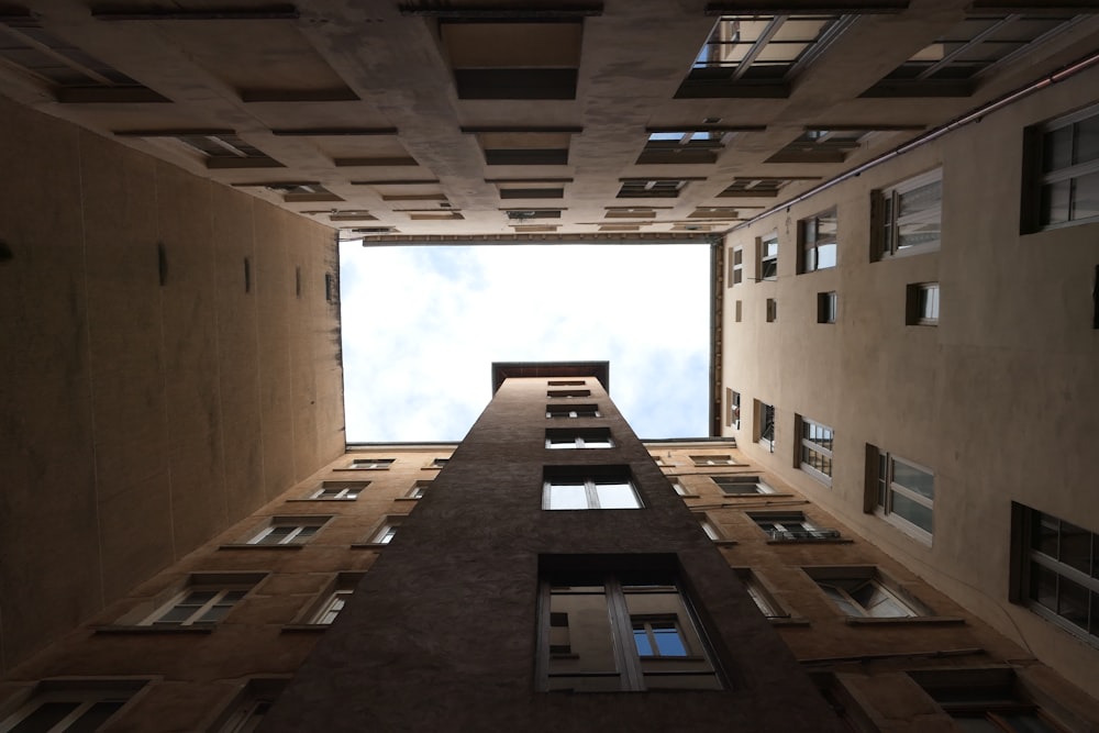 looking up at a tall building from the ground