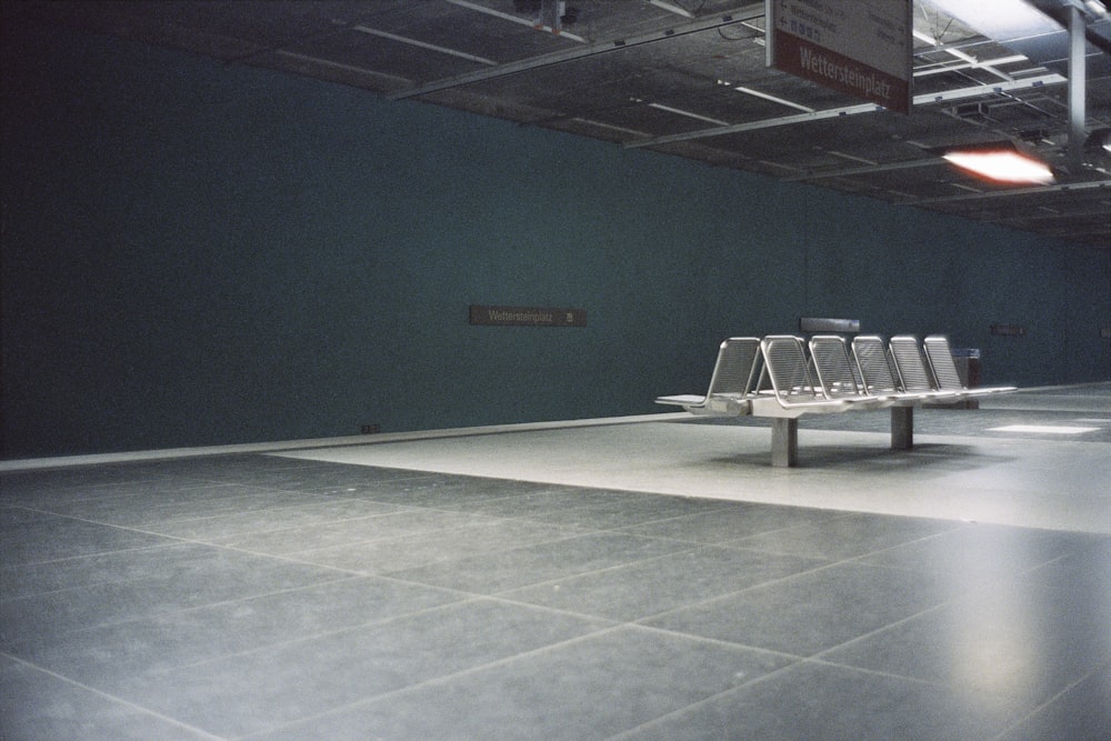 an empty room with a row of chairs