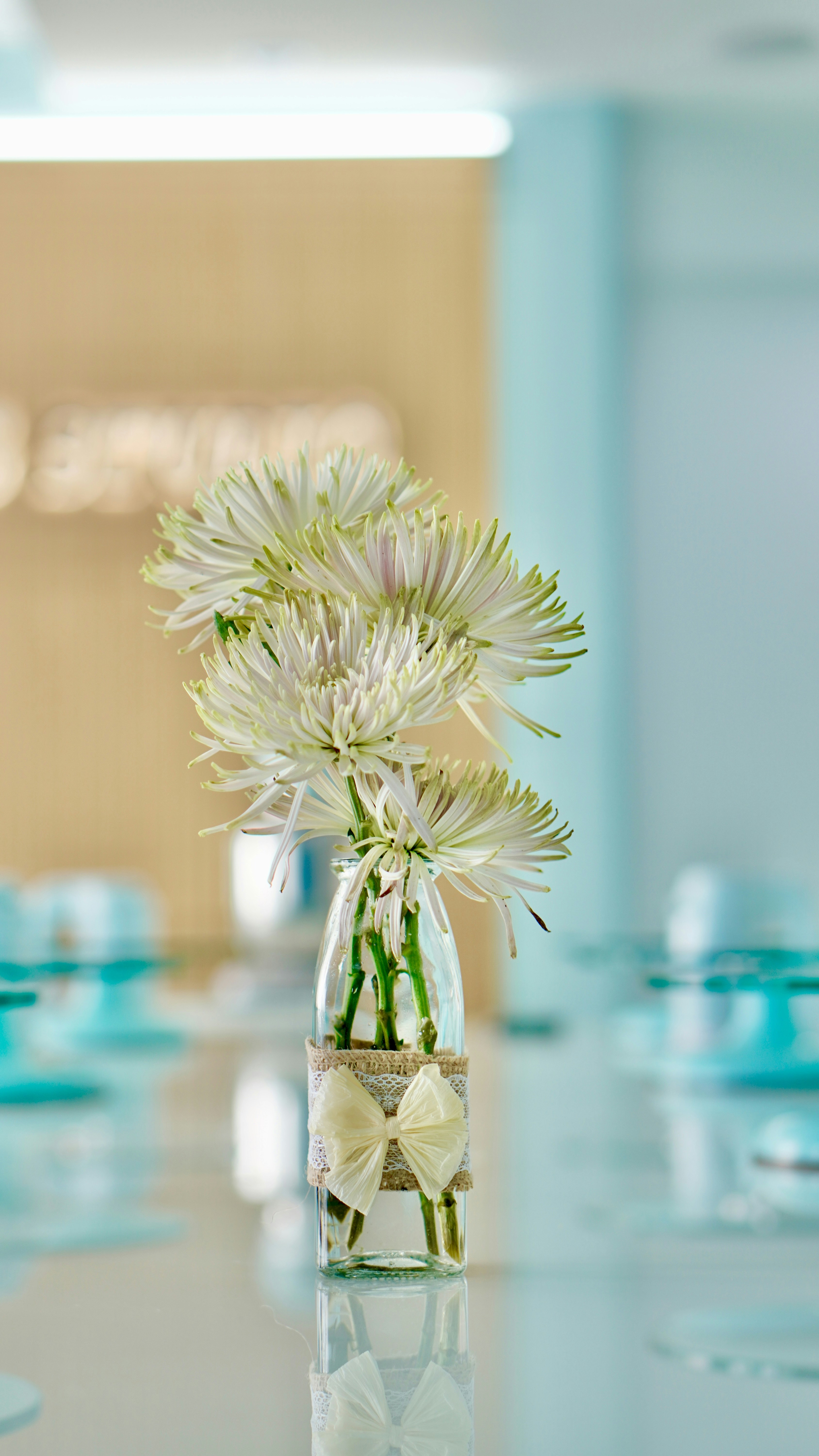 a vase filled with white flowers on top of a table