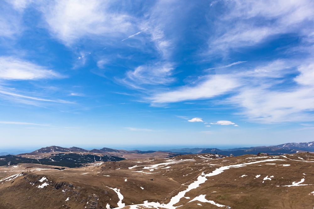 the view from the top of a snowy mountain