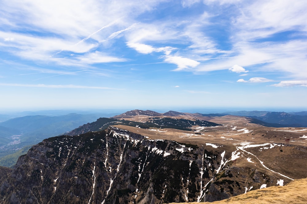 a view of a mountain range from the top of a mountain