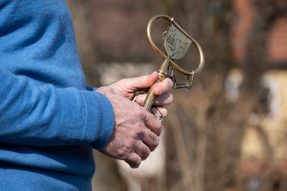 a person holding a golden key in their hand