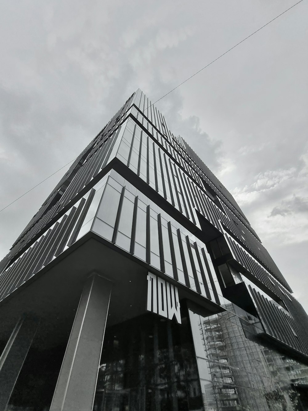 a black and white photo of a tall building