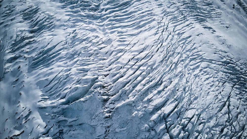 an aerial view of a snow covered mountain