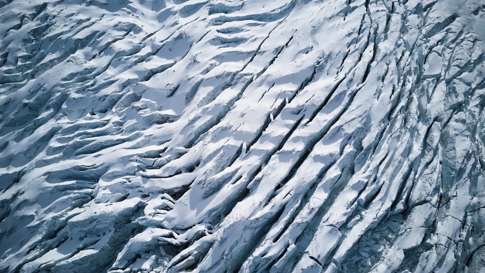 an aerial view of a snow covered mountain