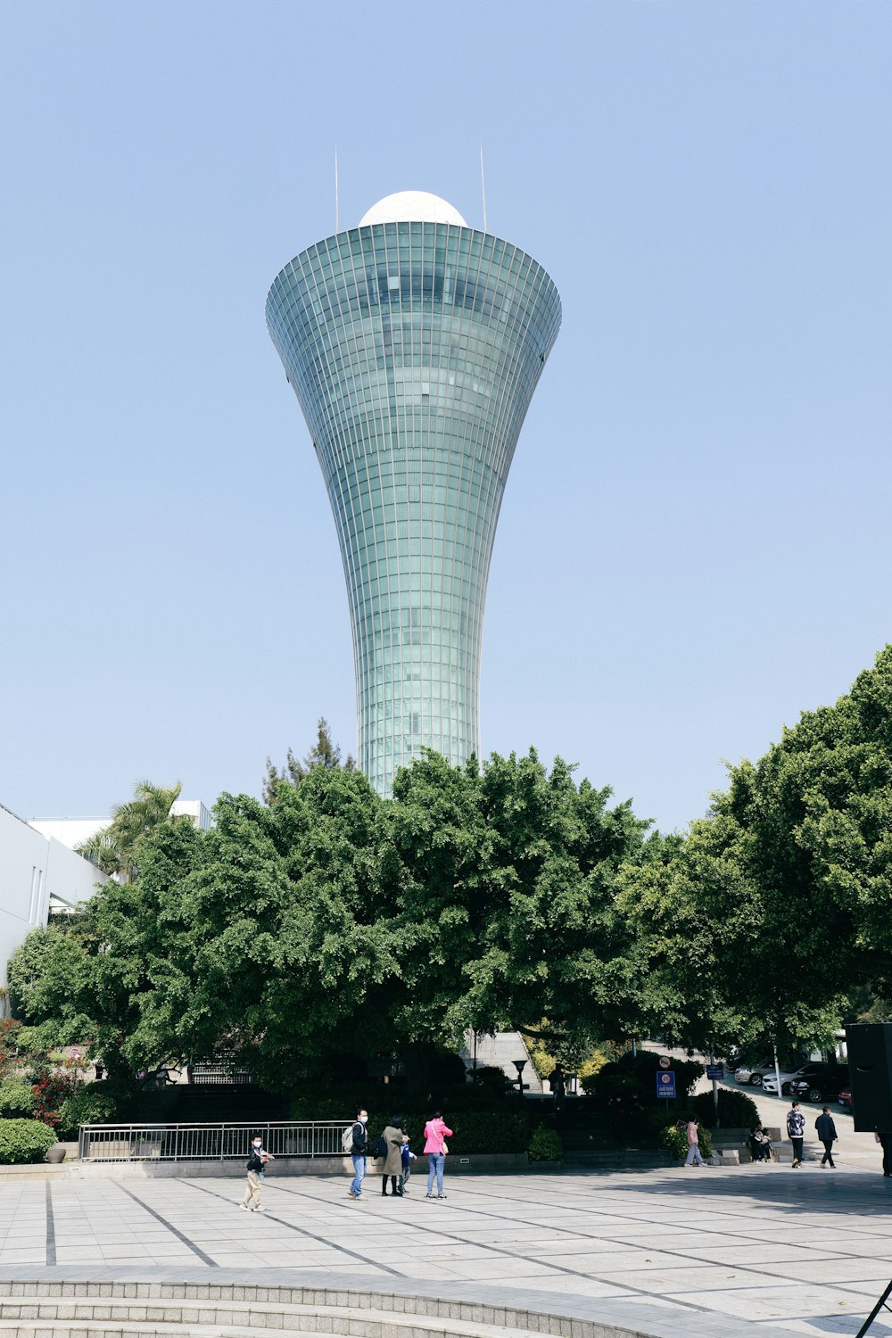 a very tall building with a very tall tower in the background