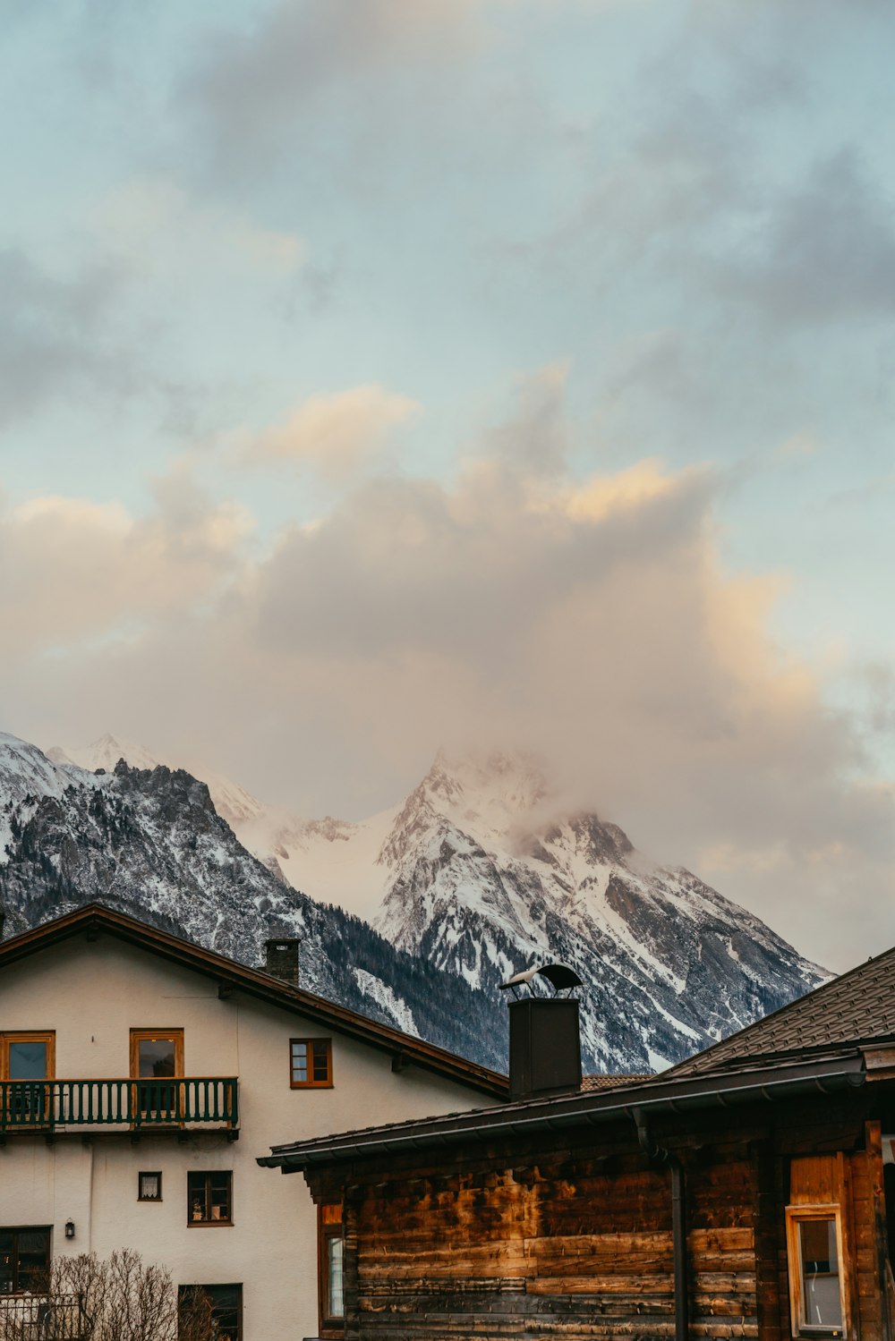 a house with a mountain in the background