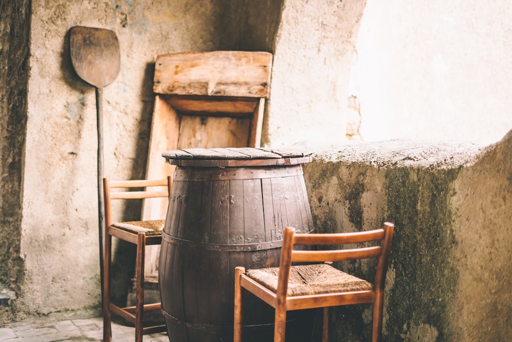 a chair and a barrel on a street