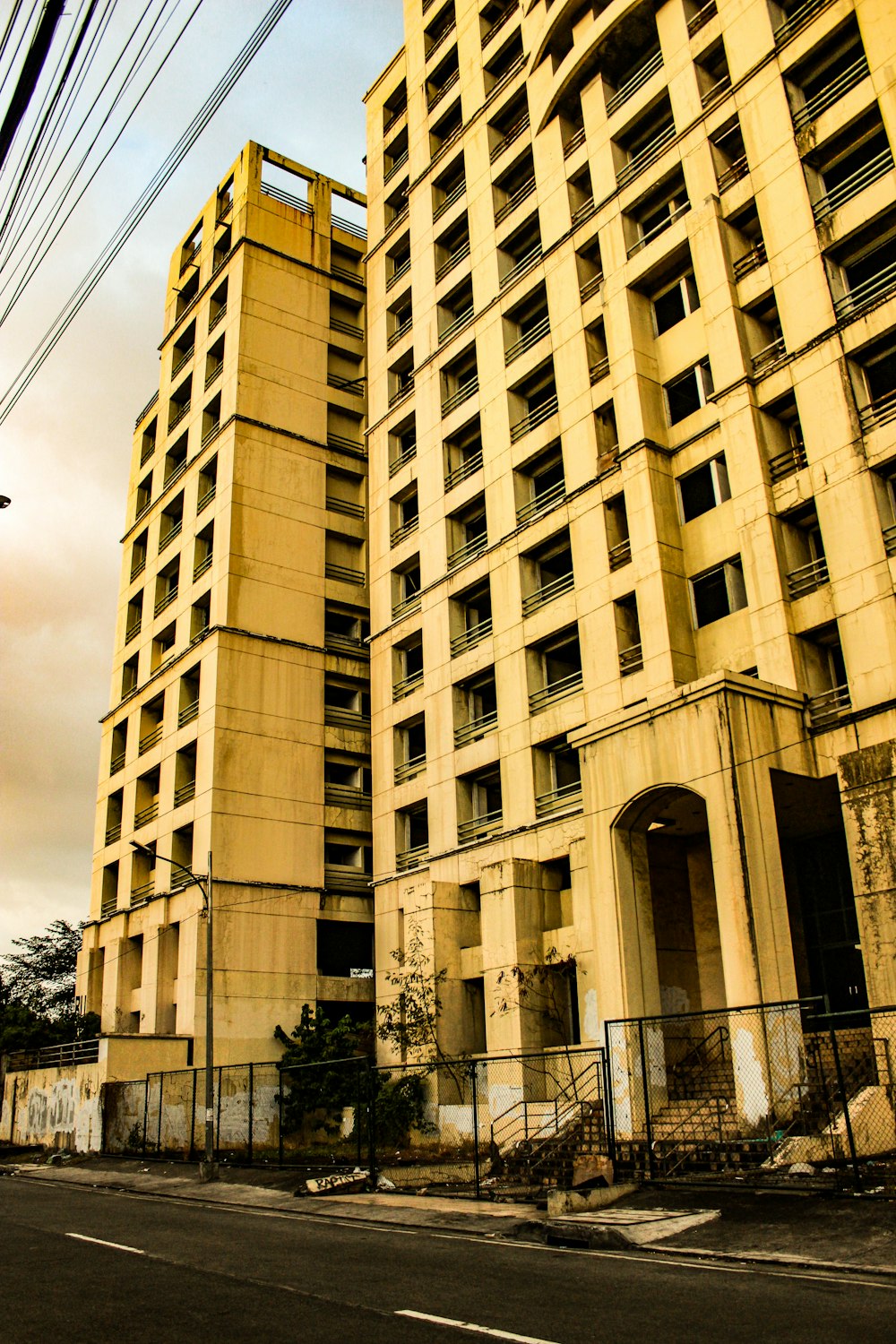 a very tall building sitting next to a street