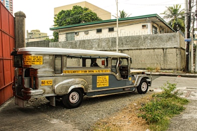 an old bus parked on the side of the road