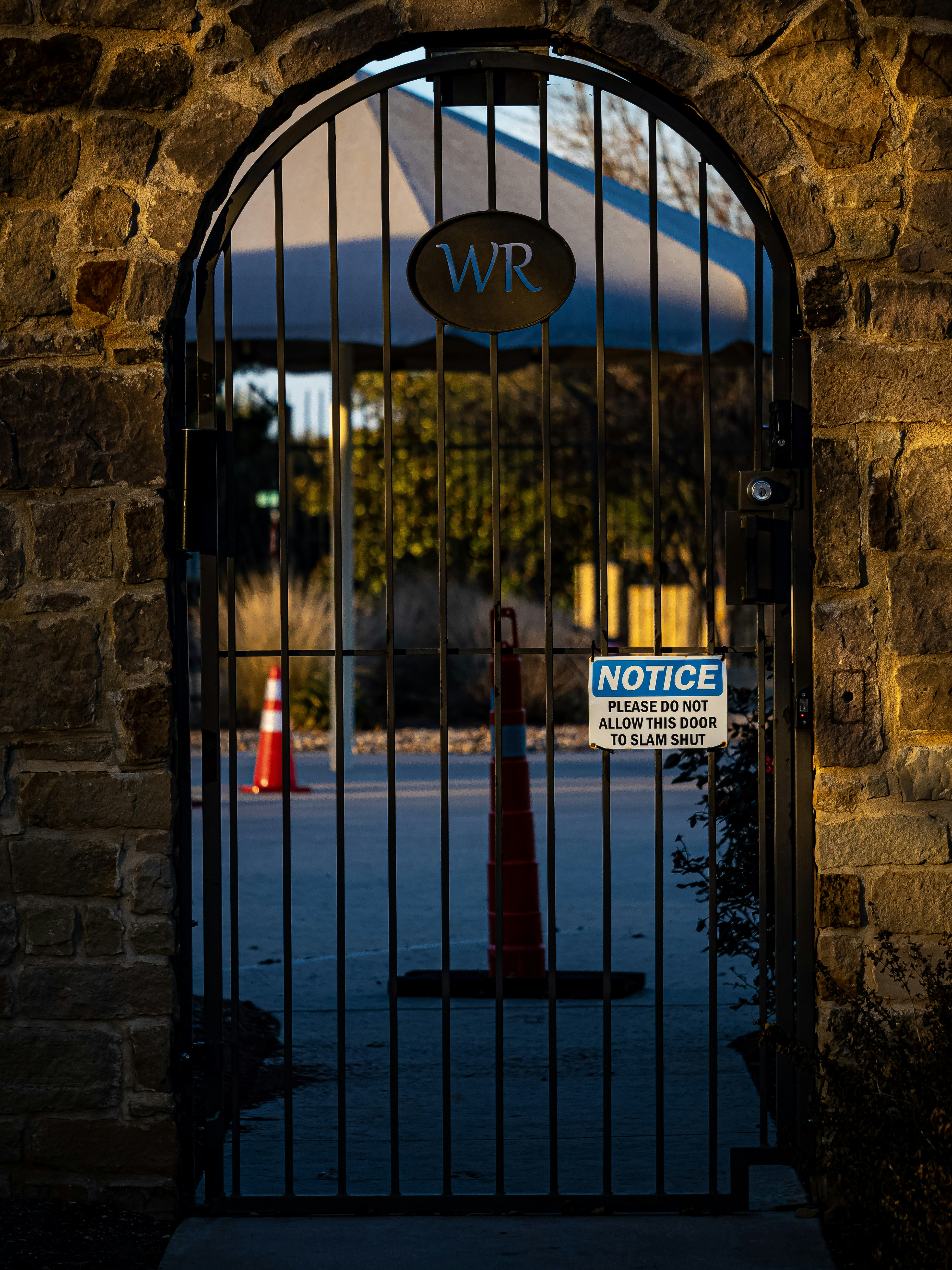 a gate that has a sign on it