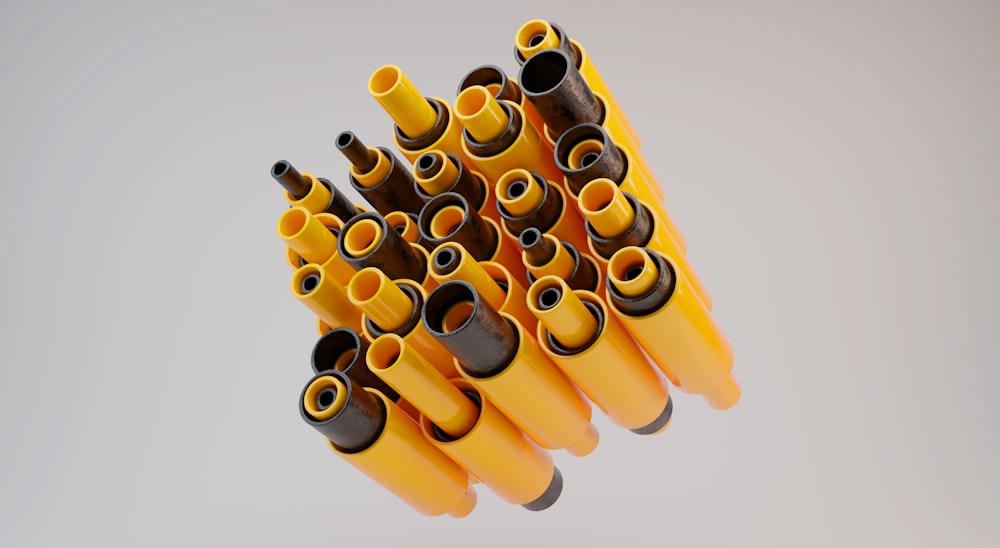 a bunch of yellow and black wires on a white background