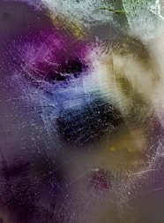 An abstract composition of layered textures blending midnight navy and pearl white hues.