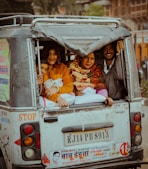 a group of people riding in the back of a truck