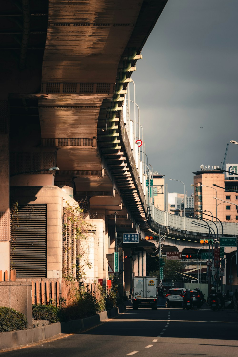 a view of a city street under a bridge