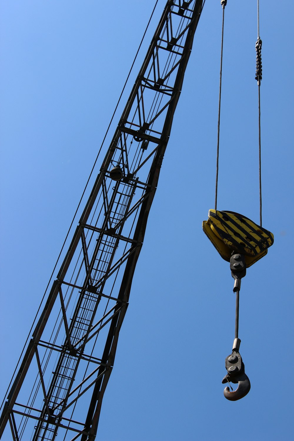 a crane is lifting a piece of equipment into the air