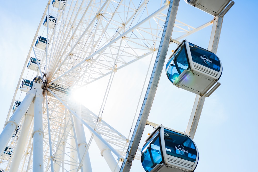 a ferris wheel is shown against a blue sky